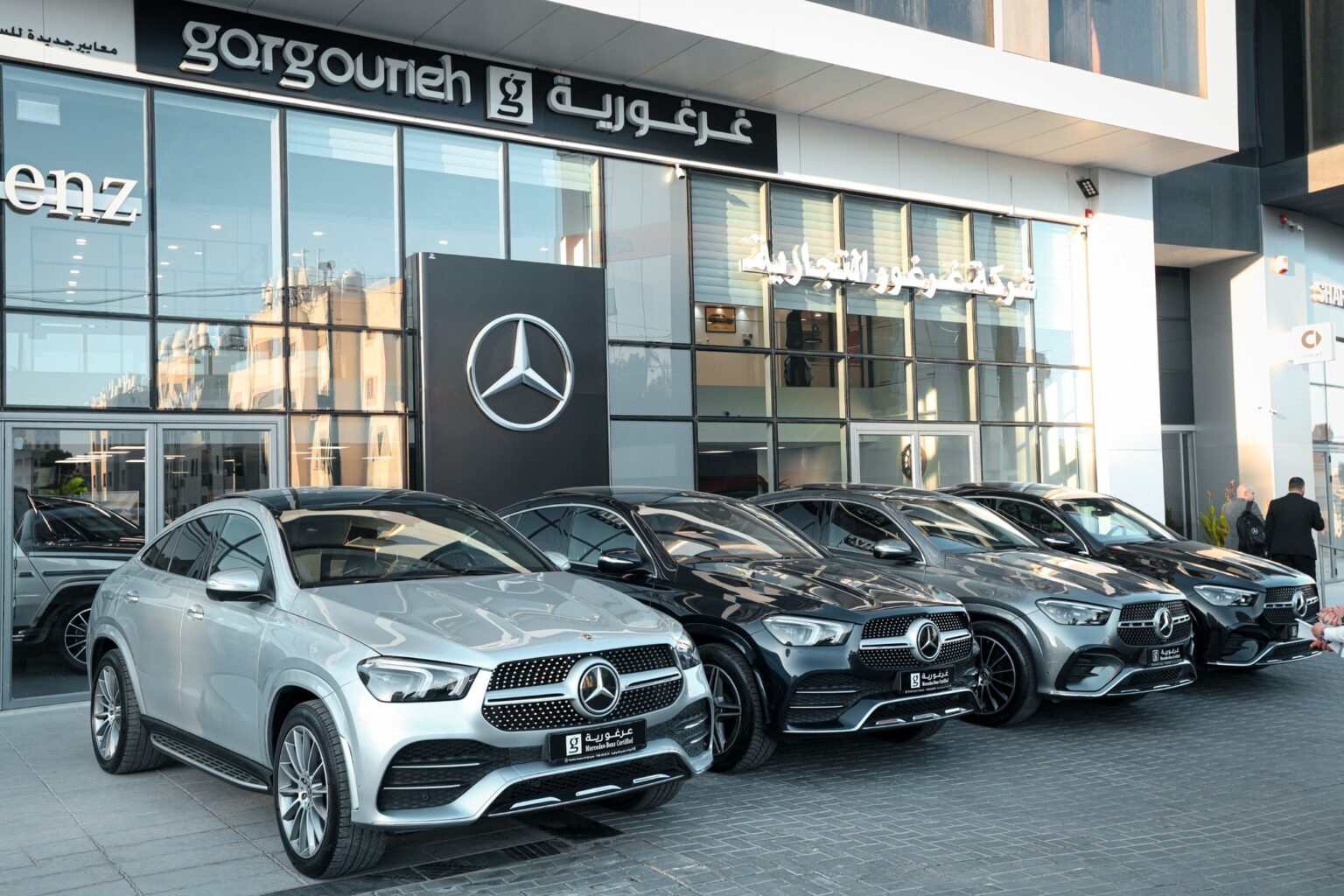 A row of pre-owned Mercedes-Benz GLE models outside the Gargourieh showroom